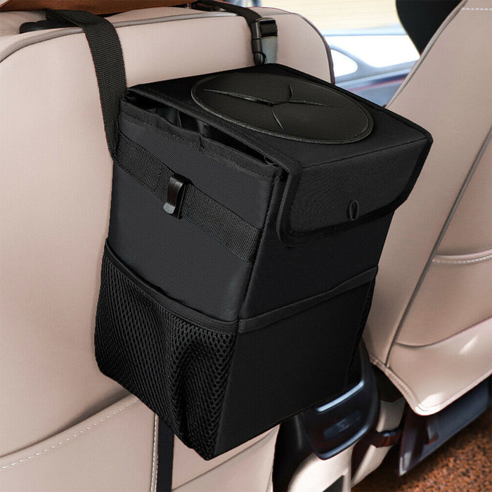 Black trash bin hanging behind a car seat