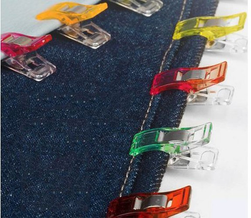Sewing clips holding layered fabric